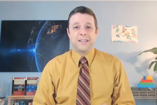 screenshot of professor talking for a news segment.