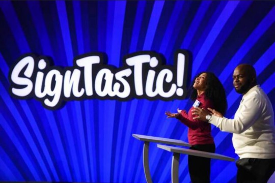 two contestants on a game show called SignTasTic!