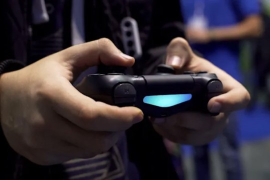 hands holding a video game controller.