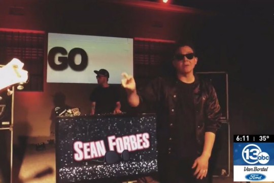 Deaf rapper Sean Forbes singing and signing.