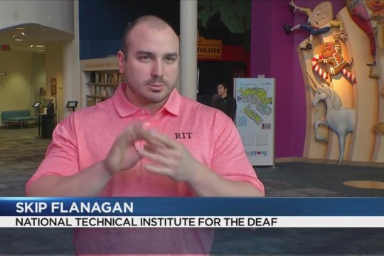 man using American Sign Language for a TV news story.
