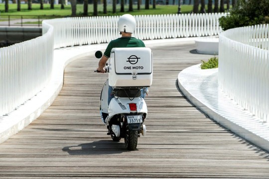 person riding a One Moto motorcycle.