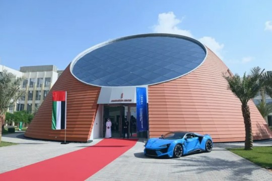 building that looks like a dome topped with glass panes forming a microchip.