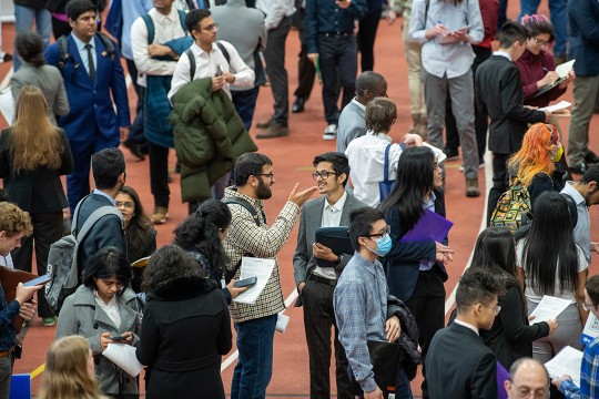 crowd of college students at a job fair.