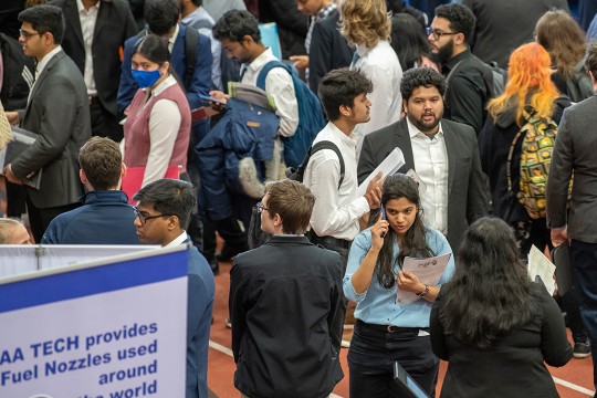 crowd of college students at a job fair.