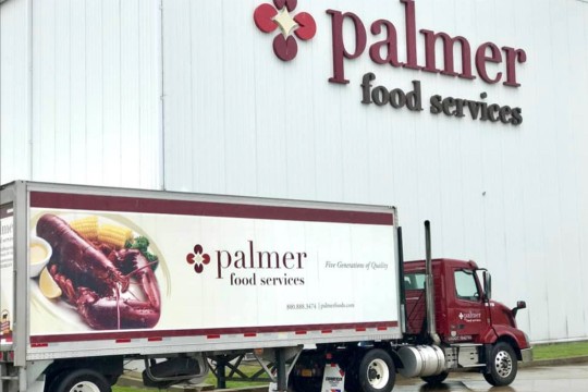 a Palmer Food Services box truck outside of a Palmer Food Services factory.