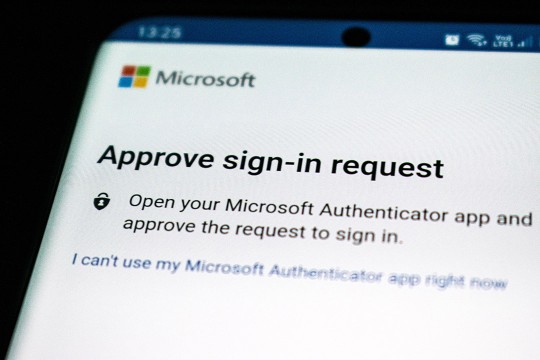 a screenshot from a computer that reads, approve sign in request. Open your Microsoft Authenticator app and approve the request to sign in.