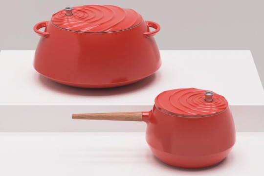 a red stockpot and a smaller red saucepan, both with a ripple design on the lids.