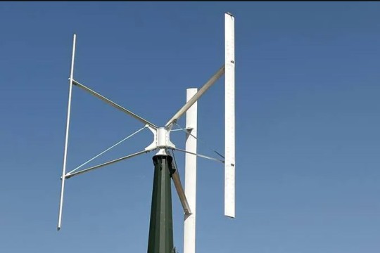 a wind turbine with three vertical blades.