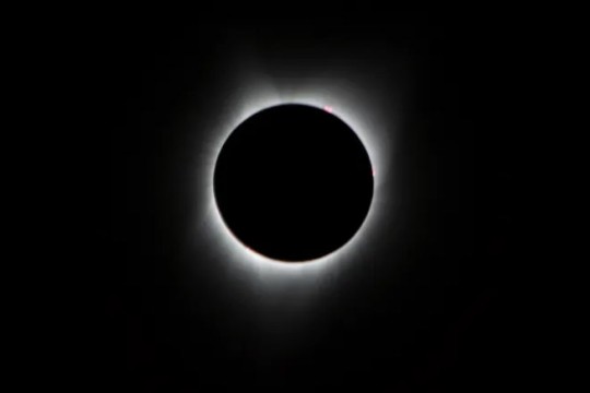 the sun is shown in a total eclipse