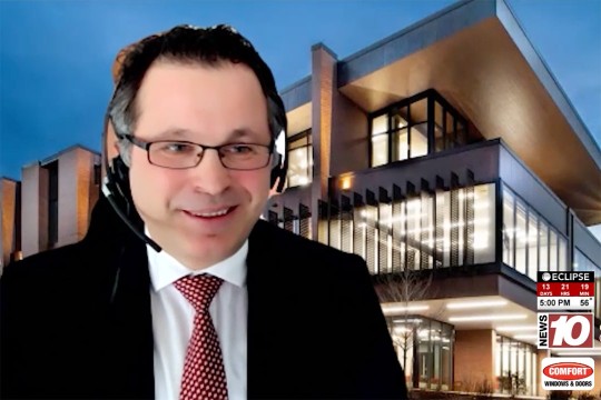 Muhammet Kesgin appears on WHEC TV in a black suit and red tie.