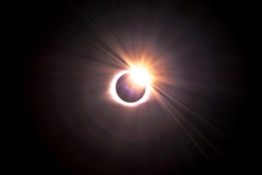 the sun is shown in a total eclipse