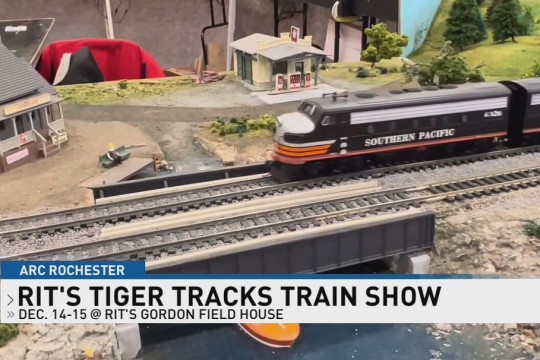A model train is shown in a photo.