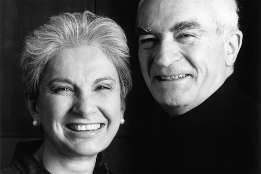A black and white portrait of Lella, left, and Massimo, right, Vingelli. The photo is focused on their faces and they are only visible from the shoulders up.
