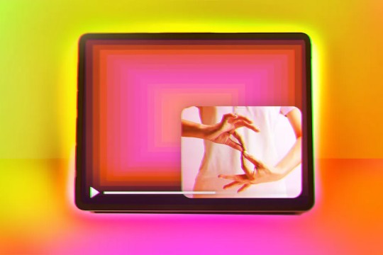 A tablet with a person signing in a window in the corner