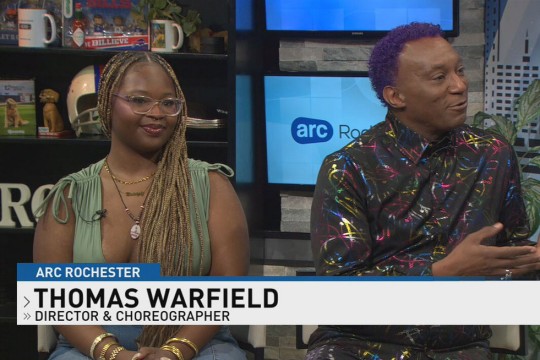 a young woman sits with a male instructor on the set of ARC Rochester
