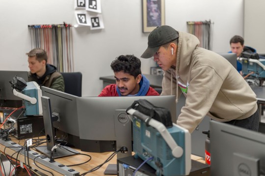 'students work together in an engineering computer lab'