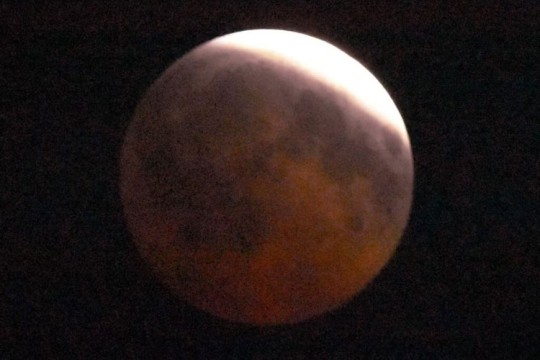 a zoomed in photo of the moon during a lunar eclipse