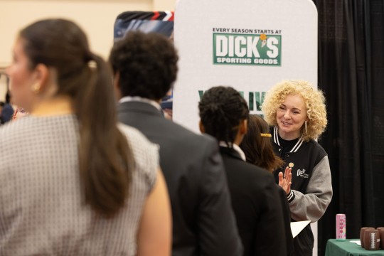 'RIT alumna Anna Heiser, right, interviews students for co-op and internship opportunities at the fall University-Wide Career Fair'