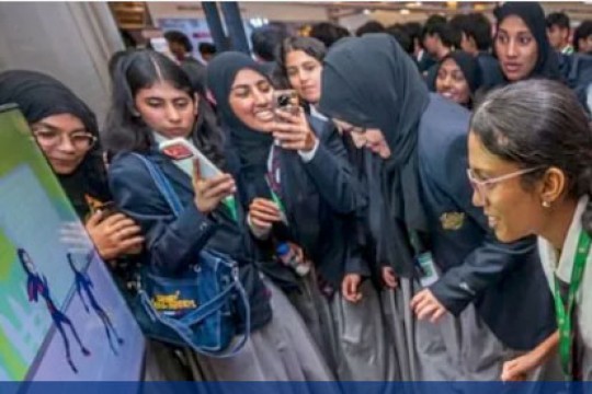 students play a simulation game at the K T Uni Expo in Dubai