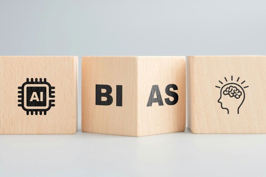 three wooden blocks with letters and line drawings on a surface