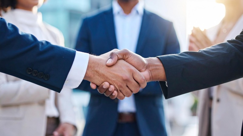 Two people shaking hands.