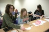 mother with two daughters doing experiment
