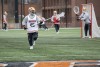 group of athletes playing lacrosse.