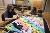 students making no-sew fleece blankets.