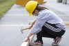 one female student hammers board