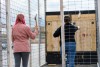two students throwing axes.