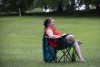 woman in chair on grass