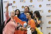 Bryan Navarro, front, joins friends for a group photo by the RIT backdrop.
<br><p>Photo by A. Sue Weisler</p>