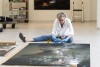 Wendy Marks, director of Finance and Administration Galleries, measures a print before hanging.
<br><p>Photo by A. Sue Weisler</p>