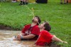 Timmy Hardy, left, and Will Shafer,&nbsp;members of Phi Kappa Psi, simulate a water fountain during the 26th Annual Mud Tug. Phi Kappa Psi and Zeta Tau Alpha hosted the event.
<br><p>Photo by Carlos Ortiz</p>