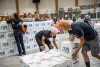 college students stacking boxes that say U S hunger.