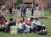 several students are shown gathered and sitting together waiting for the eclipse.