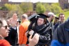 Two graduates hug