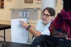 Kubert critiques the work of students.