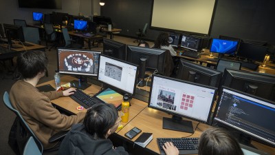 An overhead view of students work in a computer lab.