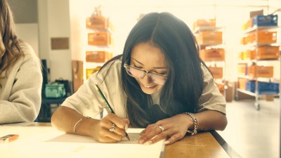 An RIT foundations students works during their 2D Design class.