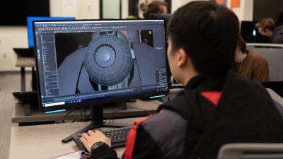student uses a 3 D modeling program.