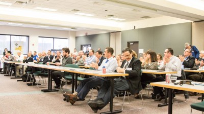 CIMS conference audience clapping.