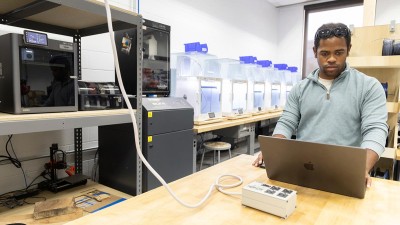 Fab Lab manager Tiree Walker works on a computer in the lab.
