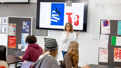 professor addresses students in a design class.