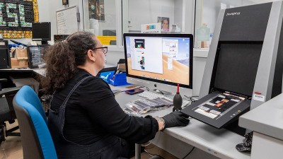 I S L manager Andrea Fernandez works in an office on a computer.