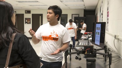 Student demonstrating his drone at Imagine RIT