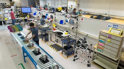 Students working on an assembly line