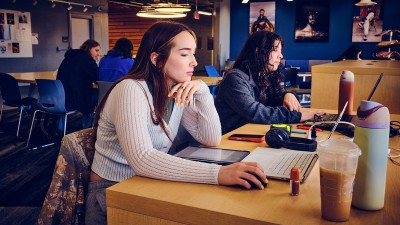 Students work on their computers in Airport Lounge.