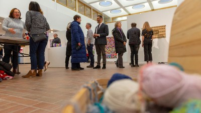 People gathered in Bevier Gallery for an opening in February 2020. 